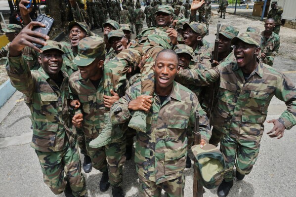 New members of Haiti's Armed Forces celebrate after their graduation ceremony in Port-au-Prince, Haiti, Tuesday, April 21, 2026. (AP Photo/Odelyn Joseph)