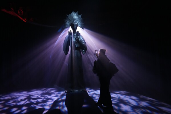The Palmist, by British-Mexican artist Leonora Carrington, sits on display at the "Magic Labyrinth" exhibition at the Center for Immersive Arts (CAI) in Mexico City on Monday, April 20, 2026. (AP Photo/Marco Ugarte)