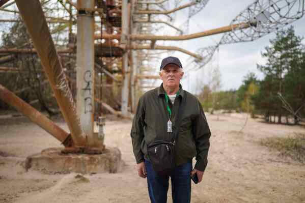 Oleksii Lebedynets, 65, who as a member of the military was sent to the Chernobyl nuclear power plant after the 1986 accident, poses for a portrait near the facility in Chernobyl, Ukraine, Tuesday, April 21, 2026. (AP Photo/Evgeniy Maloletka)