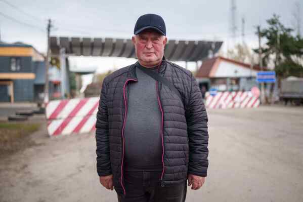 Serhii Buriak, 60, who helped guard abandoned buildings after the 1986 Chernobyl nuclear accident, poses for a portrait near the plant in Chernobyl, Ukraine, Tuesday, April 21, 2026. (AP Photo/Evgeniy Maloletka)