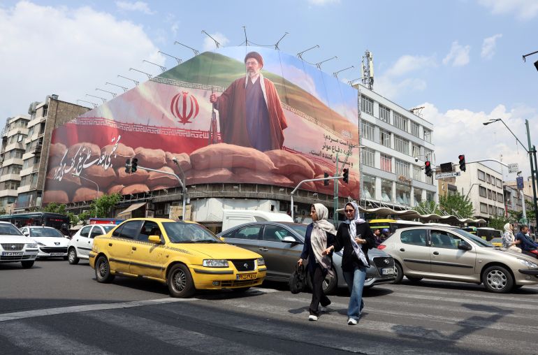 epaselect epa12901984 Iranians walk past a large billboard of Iranian Supreme Leader Ayatollah Mojtaba Khamenei on a street in Tehran, Iran, 20 April 2026. Conflict between Iran and the US over the Strait of Hormuz continues as Iran again closed the strait, as the Iranian foreign ministry spokesman said on 20 April that Iran has no plan to participate in Pakistan talks with the US yet. EPA/ABEDIN TAHERKENAREH