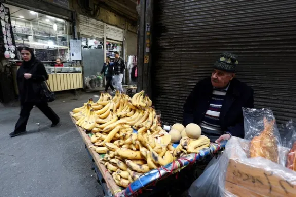 man sells fruit at the Grand Bazaar, amid the US-Israeli conflict with Iran, in Tehran, Iran, March 18, 2026.