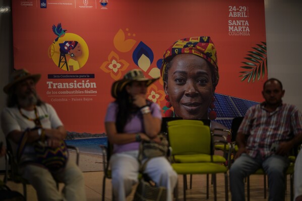 People attend a session during a conference aimed at transitioning away from fossil fuels Monday, April 27, 2026, in Santa Marta, Colombia. (AP Photo/Ivan Valencia)