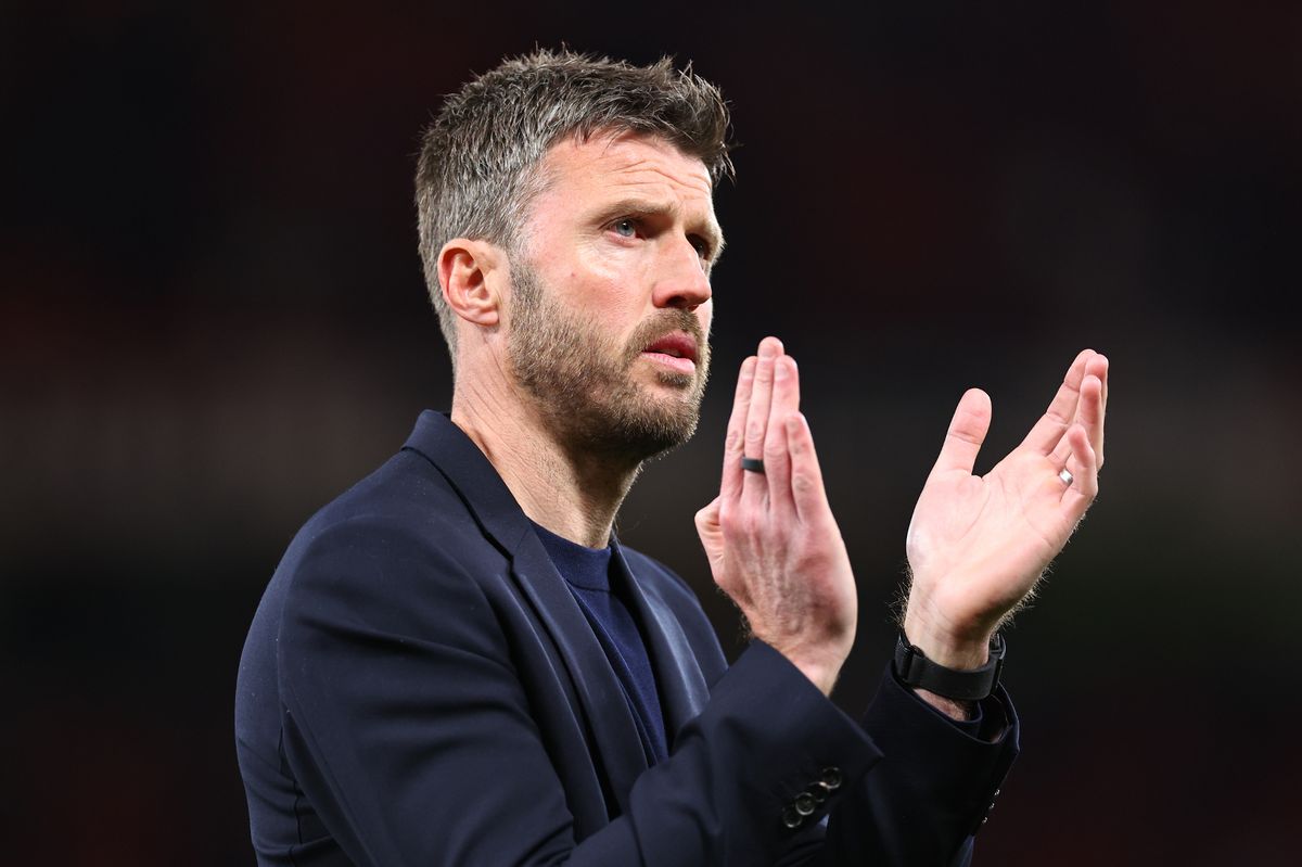 Michael Carrick applauds