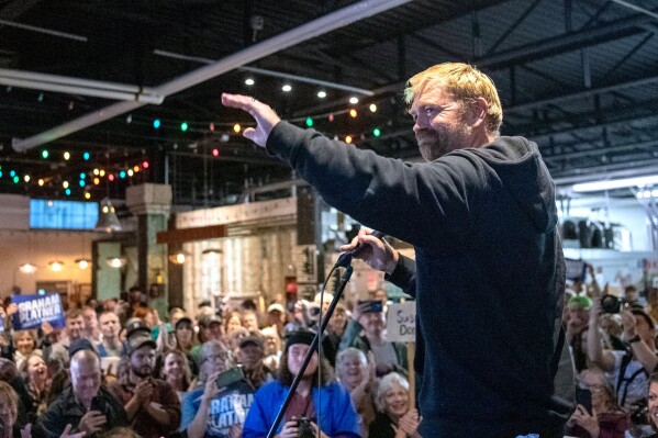 Senate candidate Graham Platner acknowledges the large crowd that attended Platner's town hall, Sept. 25, 2025, at Bunker Brewing in Portland, Maine. (Daryn Slover/Portland Press Herald via AP, File)