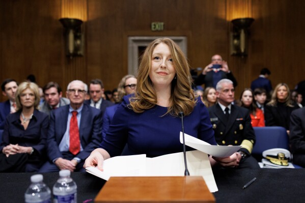 Dr. Casey Means takes her seat at the start of a Senate Health, Education Labor and Pension Committee confirmation hearing for U.S. Surgeon General on Capitol Hill, Feb. 25, 2026, in Washington. (AP Photo/Tom Brenner, File)
