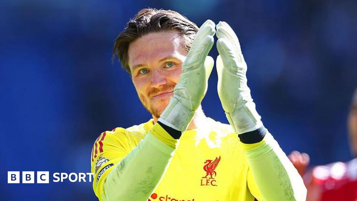 Liverpool goalkeeper Freddie Woodman applauds the crowd after the Merseyside derby
