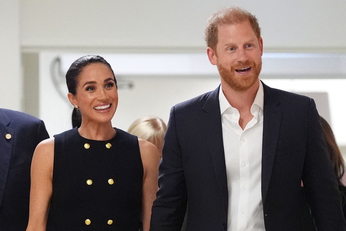 Britain's Prince Harry (R), Duke of Sussex, and his wife Meghan (L), the Duchess of Sussex, visit the Royal Children's Hospital in Melbourne on April 14, 2026. (Photo by Jonathan Brady / POOL / AFP via Getty Images)