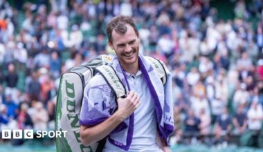 Jamie and Andy Murray touch hands