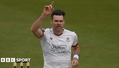 Sir James Anderson takes a wicket and celebrates with his right hand in the air