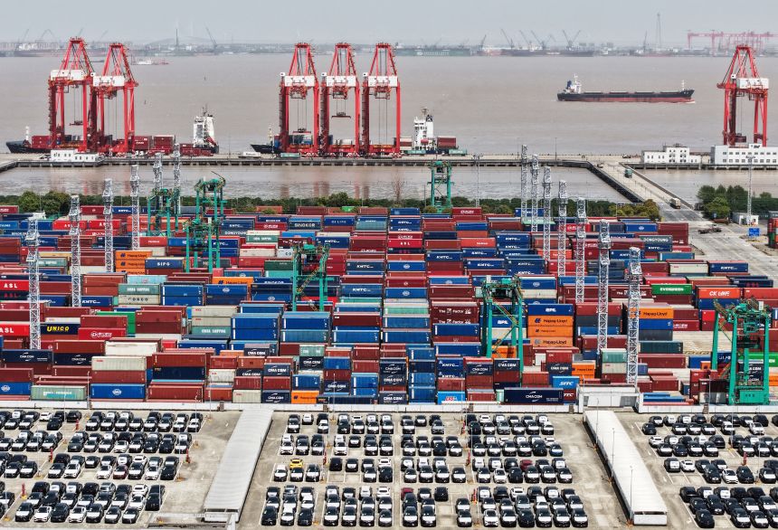 Electric vehicles are ready for export from a port in Shanghai last spring.