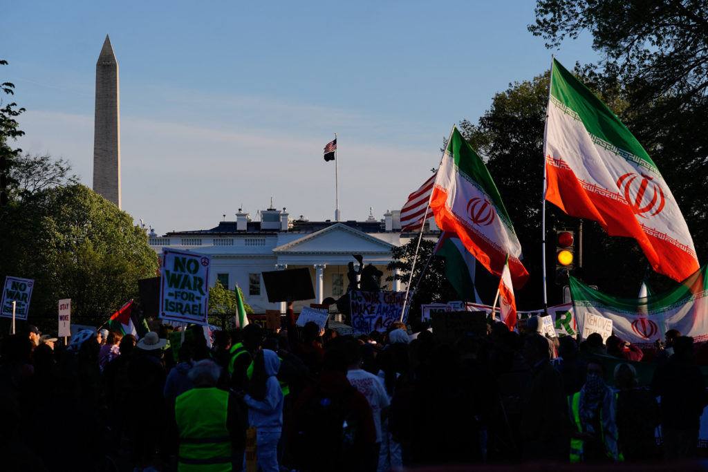 Demonstrators protest against military action in Iran after U.S. President Donald Trump said that he had agreed to a two-w...