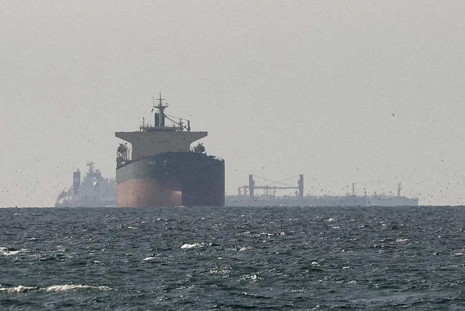 Three cargo ships in the Gulf, near the Strait of Hormuz.