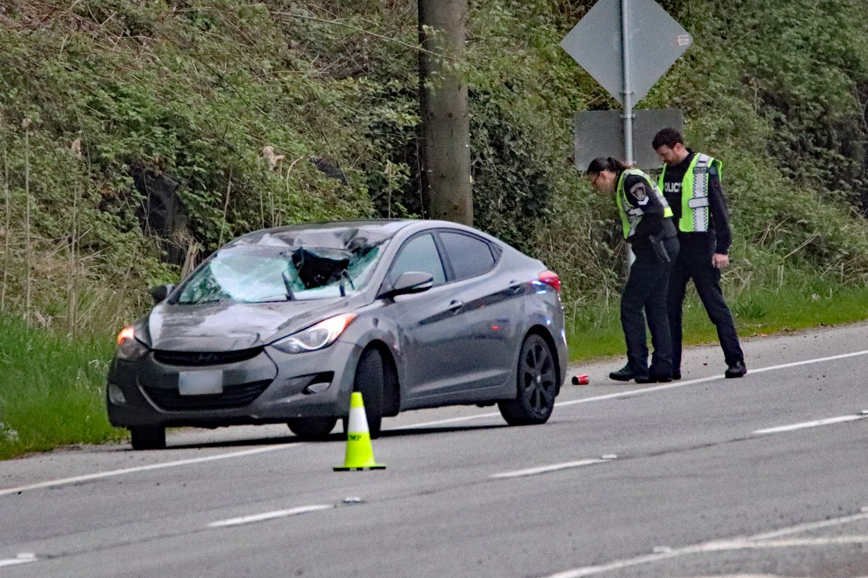 Police respond to the scene of a crash on Lougheed Highway in Maple Ridge