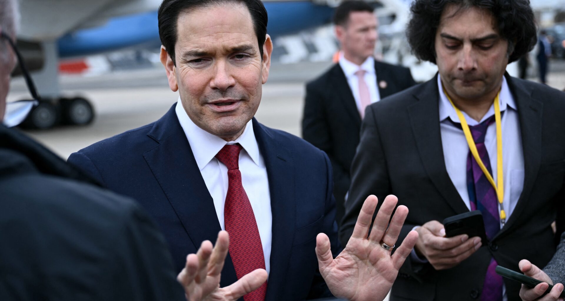 U.S. Secretary of State Marco Rubio gestures as he speaks to the press following a G7 Foreign Ministers' meeting with partner countries before his departure at the Bourget airport in Le Bourget, outside Paris, on March 27, 2026.