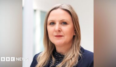 Sam Dennis is pictured. She is a white woman with long blond hair.