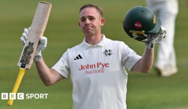 Nottinghamshire's Jack Haynes raises his bat to celebrate getting a century
