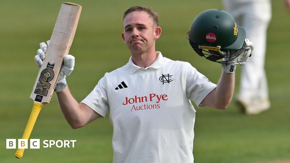Nottinghamshire's Jack Haynes raises his bat to celebrate getting a century