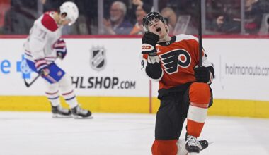 Flyers' Oliver Bonk celebrates on one knee on the ice while a Canadiens player in the background looks down at his feet.