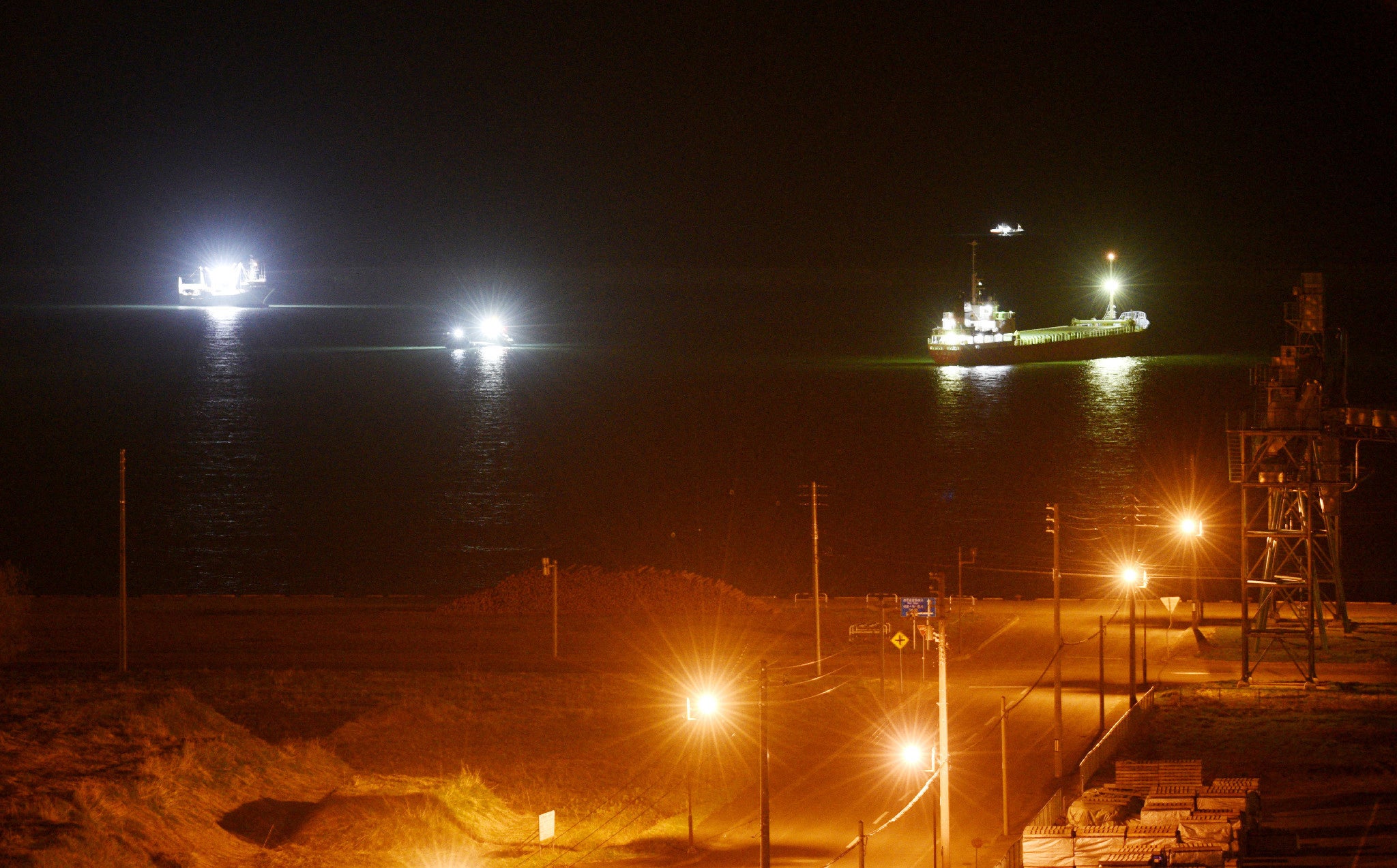 Boats are seen offshore around Tokachi Port in Hiroo Town, Hokkaido, on 20 April 2026, following a tsunami warning after an earthquake off the coast earlier in the day