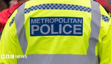 a close up stock image of the back of a uniformed Metropolitan Police officer