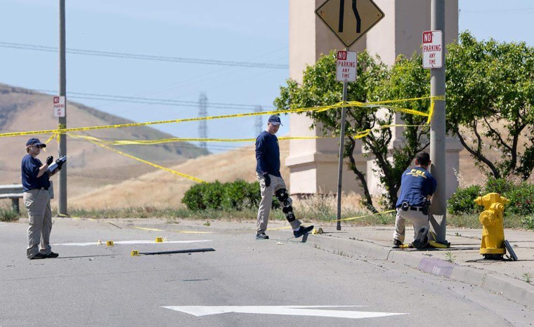 Members of the FBI evidence response team investigate an ICE shooting on Sperry Avenue in Patterson, California, on April 7, 2026.