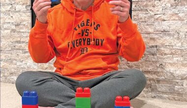 Rabbi Josh Bennett of Temple Israel in Detroit holds Lego blocks, urging families to add the children’s toy to their Seder plates in the wake of a recent attack on the synagogue. – Facebook