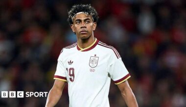 Lamine Yamal wearing a white Spain shirt