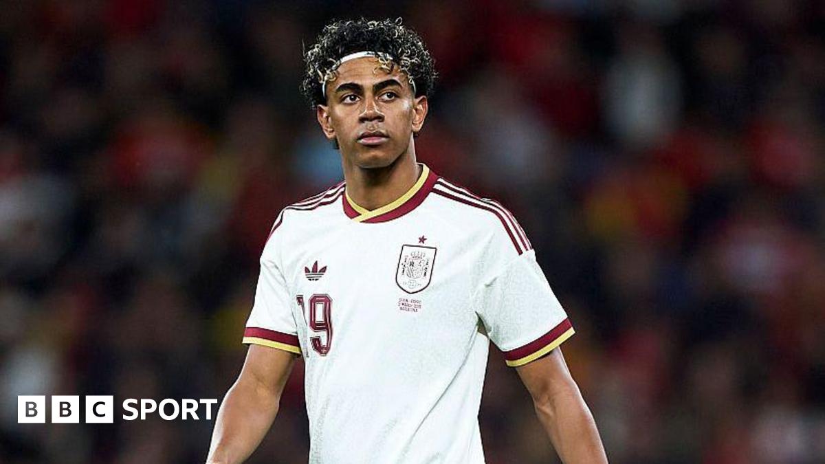 Lamine Yamal wearing a white Spain shirt