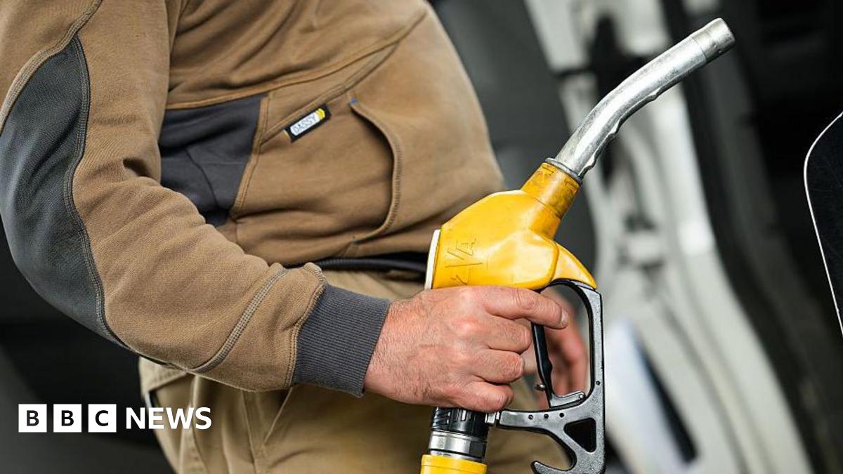 A man fills in his truck with diesel at a petrol station