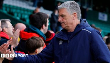John Askey shakes supporters' hands