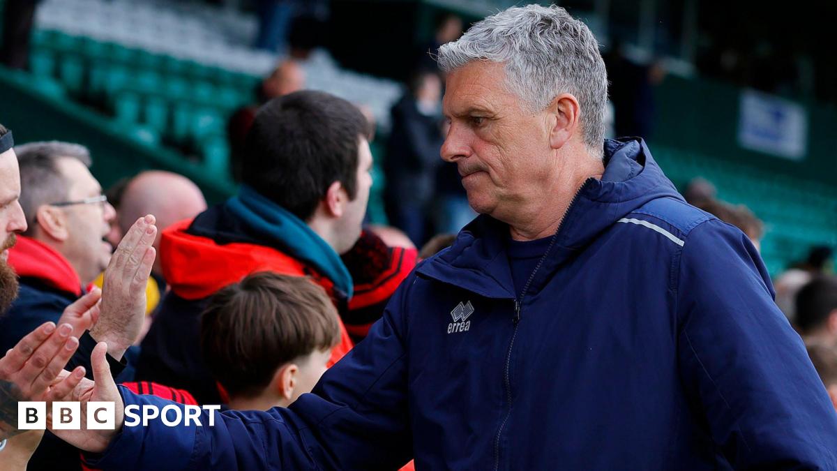 John Askey shakes supporters' hands