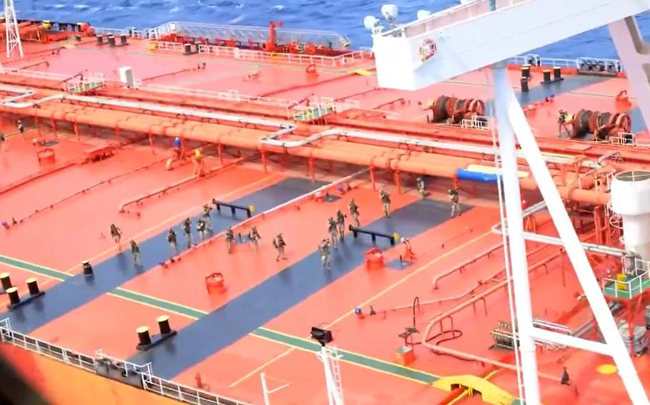 U.S. troops are shown on board an oil tanker.