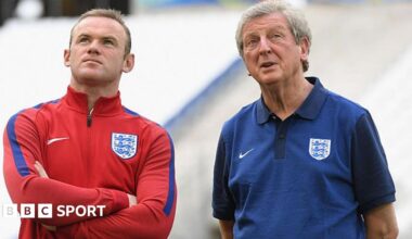 Wayne Rooney stands with England manager Roy Hodgson at Euro 2016