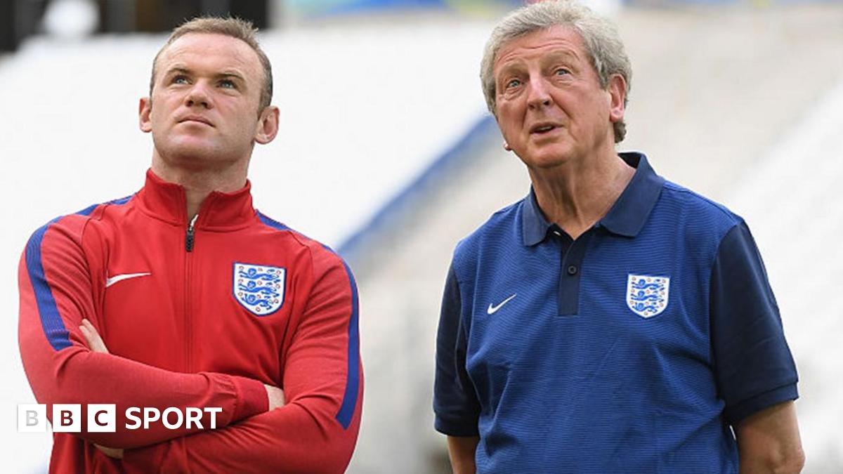 Wayne Rooney stands with England manager Roy Hodgson at Euro 2016