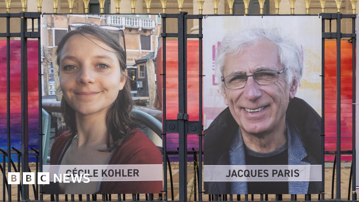 Pictures of Cecile Kohler and Jacques Paris are tied to railings.