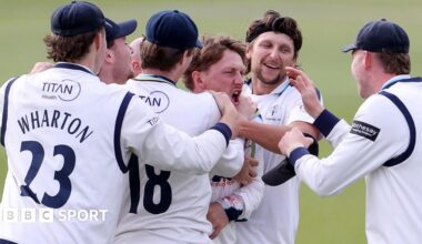 Dom Bess of Yorkshire celebrates the catch that dismissed Kiran Carlson