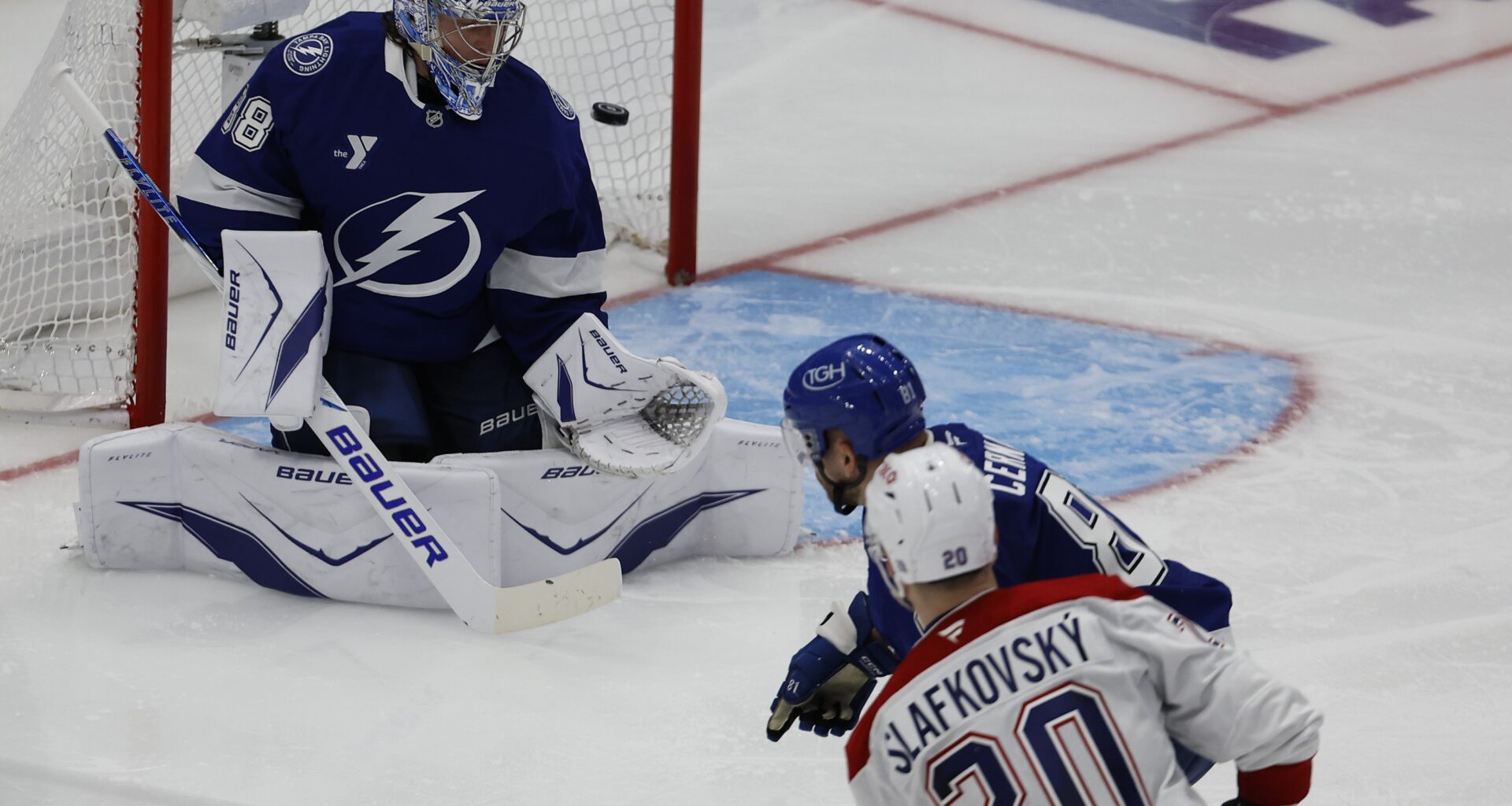 Montreal Canadiens left wing Juraj Slafkovsky scores on Tampa Bay Lightning goaltender Andrei Vasilevskiy.