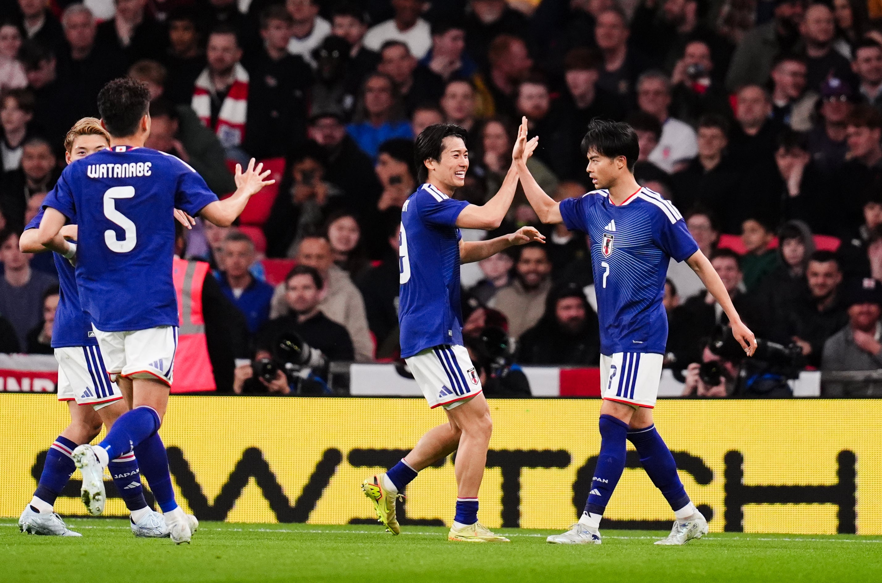 Kaoru Mitoma, right, celebrates after scoring Japan’s winner