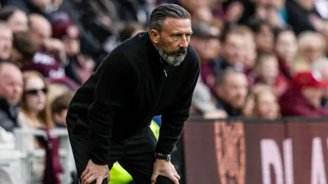 Hearts head coach Derek McInnes looks pensive