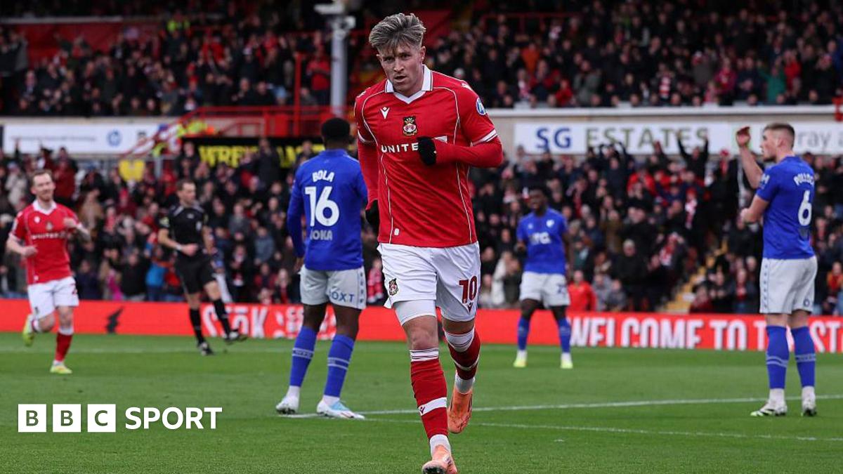 Josh Windass celebrates after scoring for Wrexham