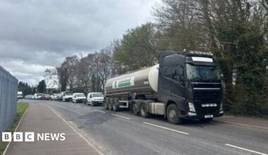 A milk tanker is seen on a road at the front of a convoy of vehicles who took part in a protest in Strabane on Saturday afternoon in protest at the rising cost of fuel
