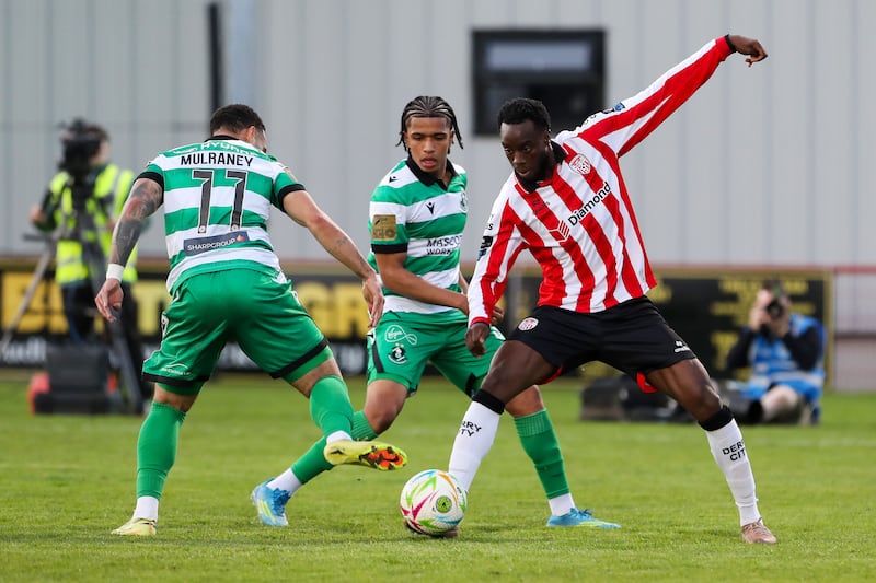 Derry’s James Olayinka in action against Shamrock Rovers’ Jake Mulraney. Photograph: Lorcan Doherty/Inpho