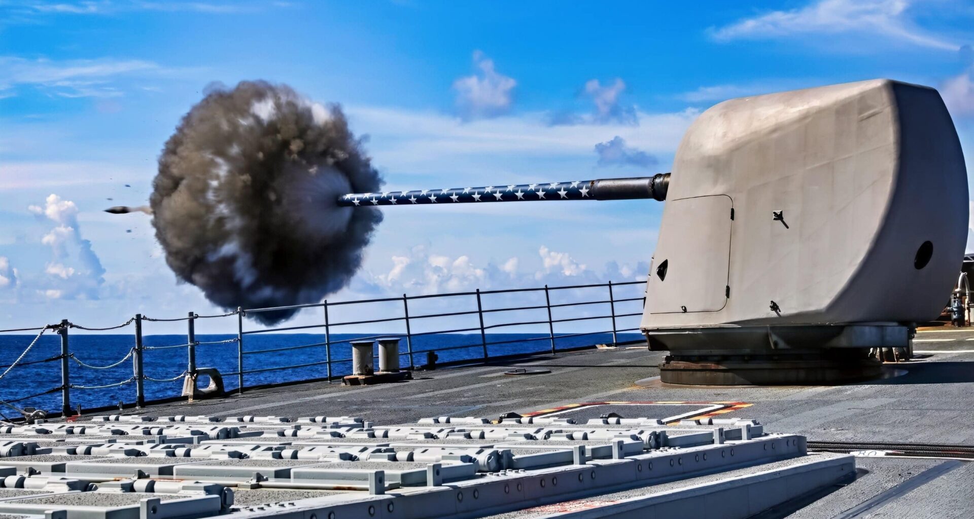 (July 29, 2025) The Ticonderoga-class guided-missile cruiser USS Princeton (CG 59) fires its forward Mark 45 5-inch gun during a weapons maintenance shoot, July 29, 2025. The Carl Vinson Carrier Strike Group is underway conducting routine operations in the U.S. 3rd Fleet area of operations. (U.S. Navy photo by Mass Communication Specialist 1st Class Jacob I. Allison)