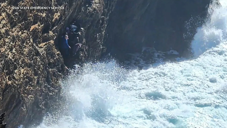 A group of tourists became trapped on a cliff along Australia's east coast when the tide came in during their morning walk on a beach. / Credit: NSW State Emergency Service