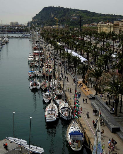 Boats of a humanitarian flotilla preparing to depart for Gaza, in Barcelona, Spain, Saturday.
