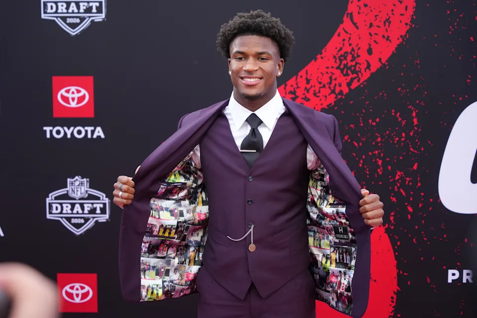 Ohio State defensive back Caleb Downs poses on the red carpet before the first round of the NFL football draft in Pittsburgh. 