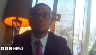 Jess Phillips MP. pictured against black background, looks off to the side