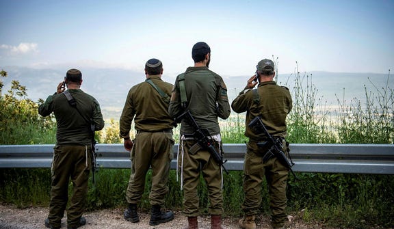 Israeli soldiers, near the Lebanese border.