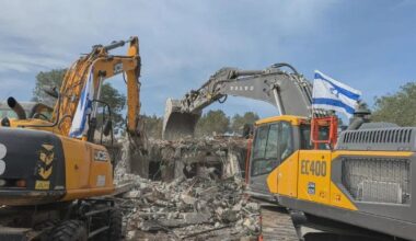 I Stand Before a Bulldozer That Is Leveling My Mother's Home, and Wonder Why It Flies an Israeli Flag